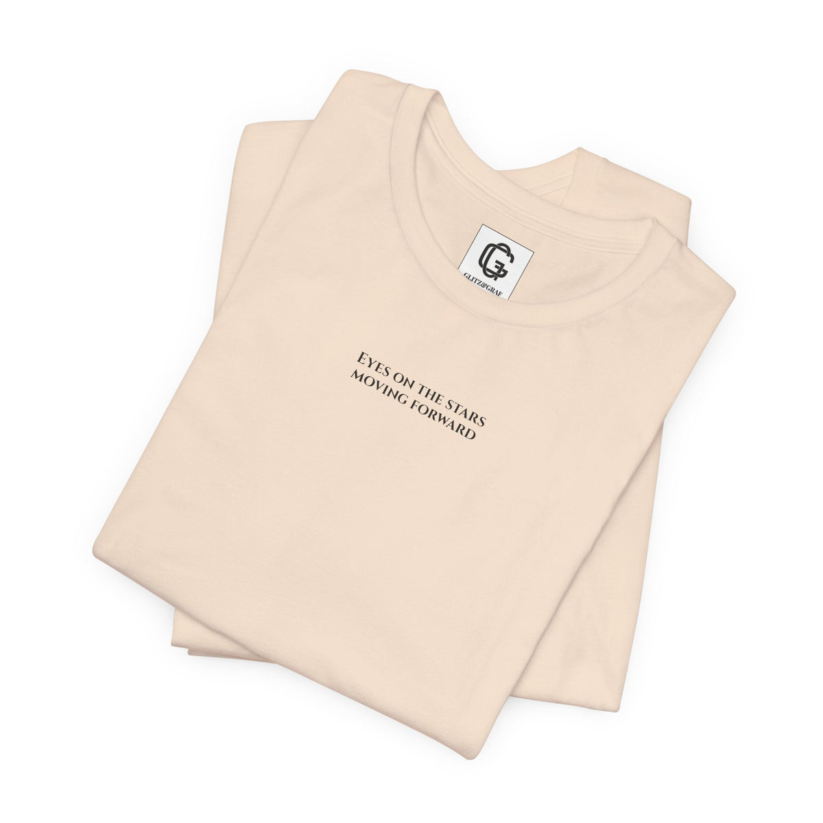 Soft Cream T-shirt with text "Eyes on the stars / Moving forward" and a brand logo on a white background