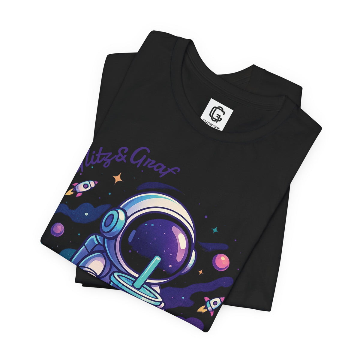 Black t-shirt with colorful astronaut design holding a bubble tea and 'Glitz&Graf' branding on a white background