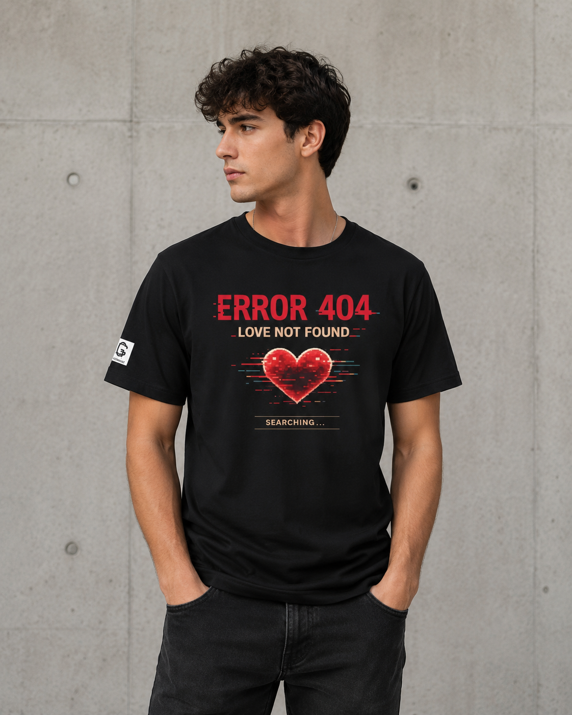 Person wearing a black t-shirt with 'ERROR 404 LOVE NOT FOUND' design against a concrete wall.